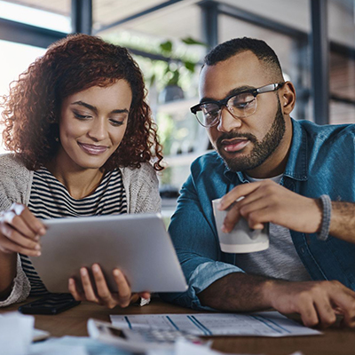 img of a couple looking at papers