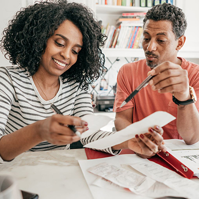 img of a couple looking at papers